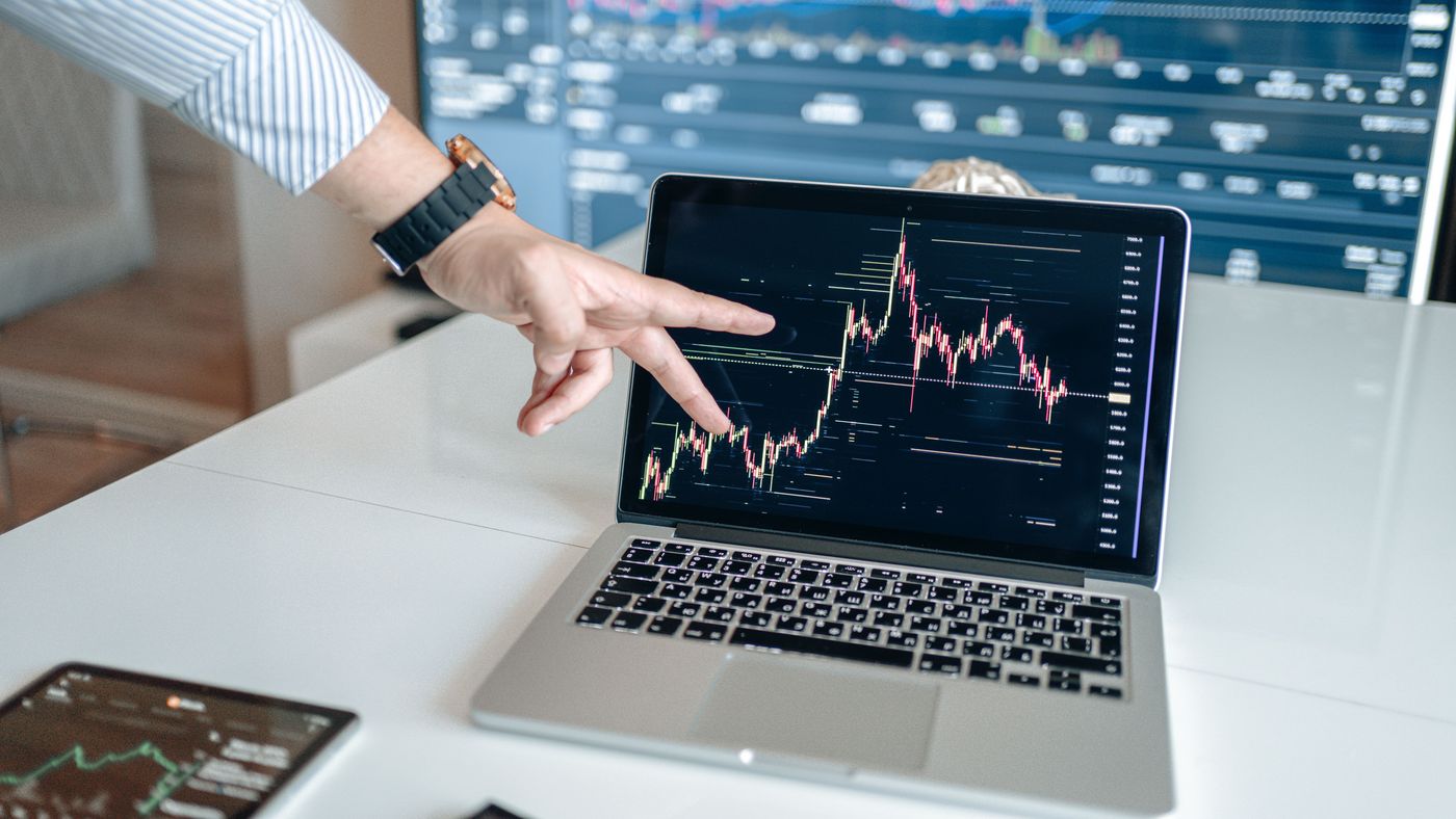 Reviewing a live price chart on a laptop